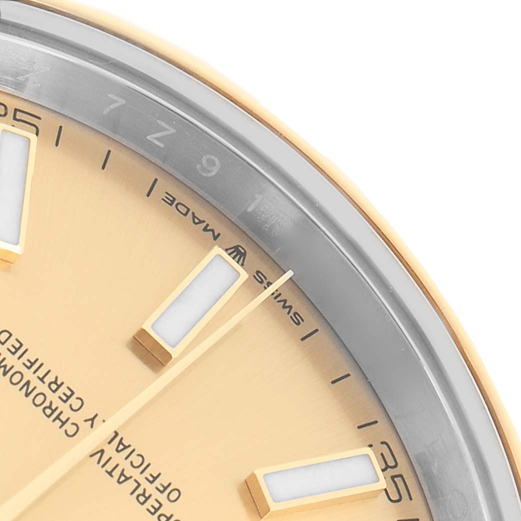 The image shows a close-up of the dial edge and bezel of the Rolex Datejust 41 126303 Men
s Steel and Gold (two tone) Champagne Dial, highlighting the markers and "Swiss Made" text.