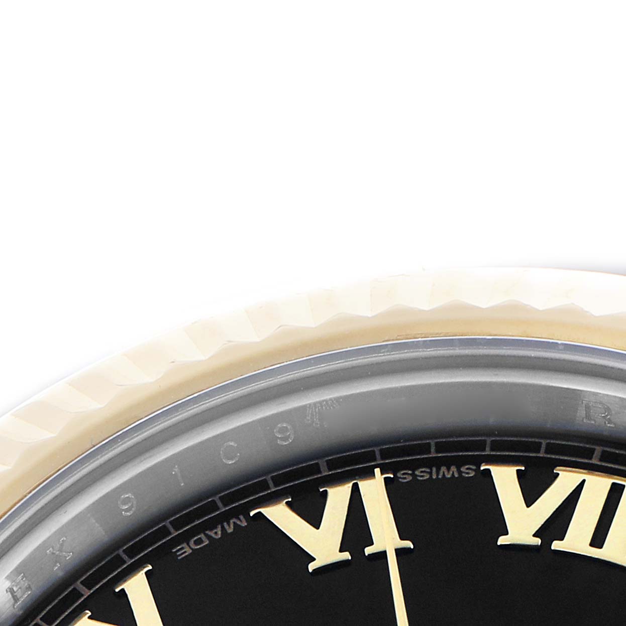 The image shows a partial view of a Rolex Datejust 41 116333 Men
s Steel and Gold (two tone) Black Dial watch, focusing on the edge of the dial with Roman numerals and the fluted bezel.