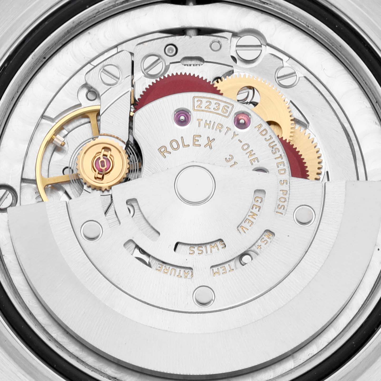 The image shows a close-up view of the internal movement of a Mid-Size Rolex watch.