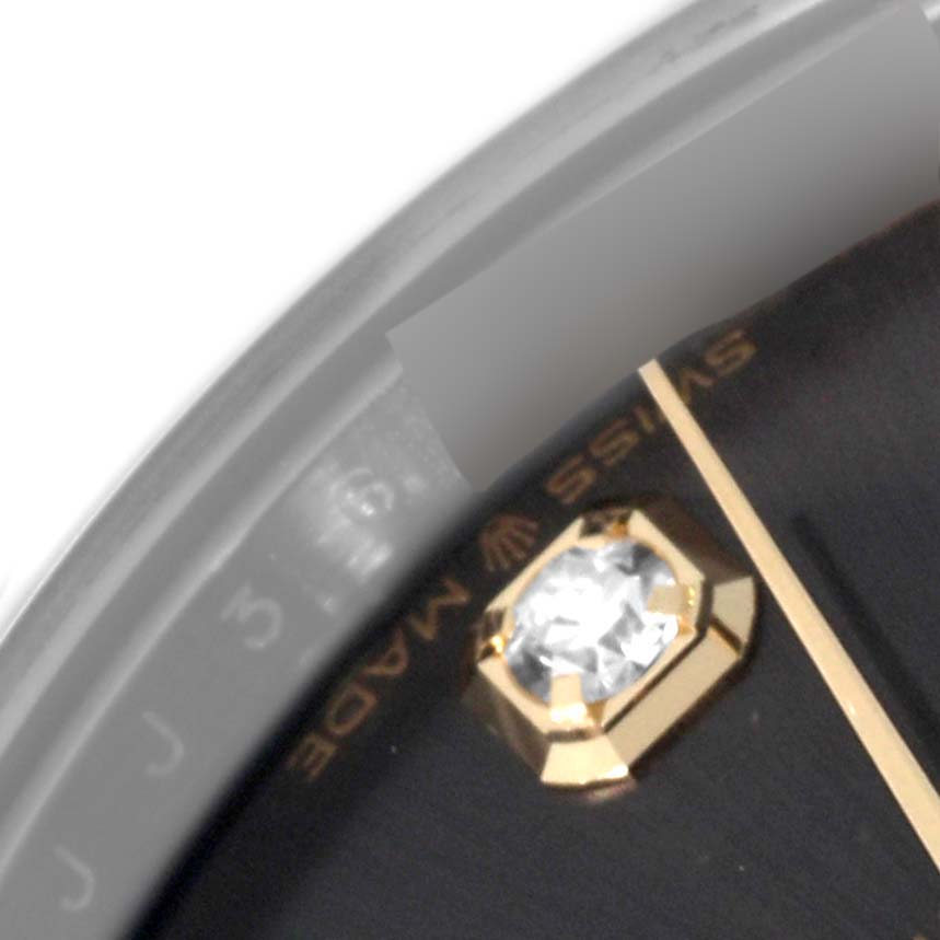 The close-up shows part of the dial, a gold hour marker set with a diamond, and a portion of the seconds hand of a Rolex Mid-Size 278343 Women's Steel and Gold (two tone) Grey Dial 278343 Women's Steel and Gold (two tone) Grey Dial model.