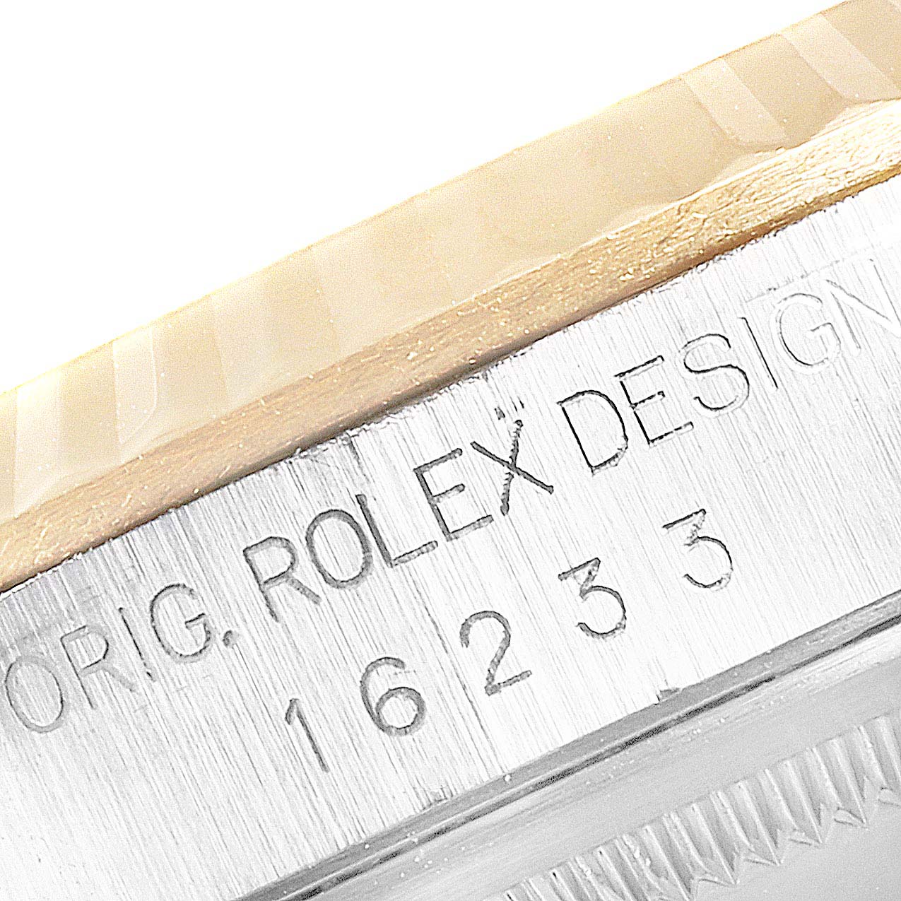 This close-up image shows the side of the case with the model number of a Rolex Datejust 16233 Men
s Steel and Gold (two tone) Champagne Dial 16233 Men
s Steel and Gold (two tone) Champagne Dial watch.