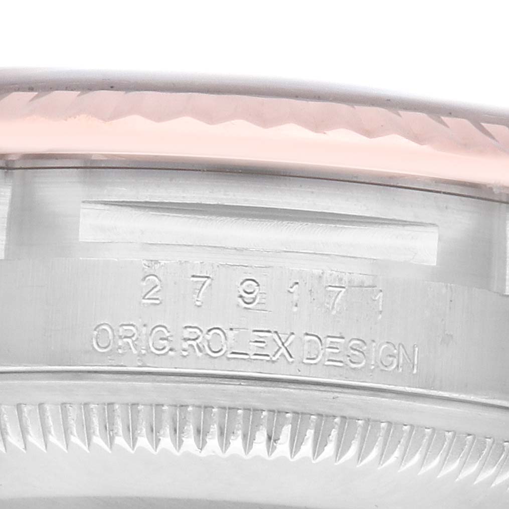 The image shows a close-up of the Rolex Datejust 279171 Women's Steel and Gold (two tone) Brown Dial model's side, highlighting the bezel and engraved text.