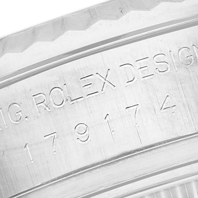 The image shows a close-up of the engraved side of a Rolex Datejust 179174 Women's Stainless Steel Pink Dial 179174 Women's Stainless Steel Pink Dial watch's case.