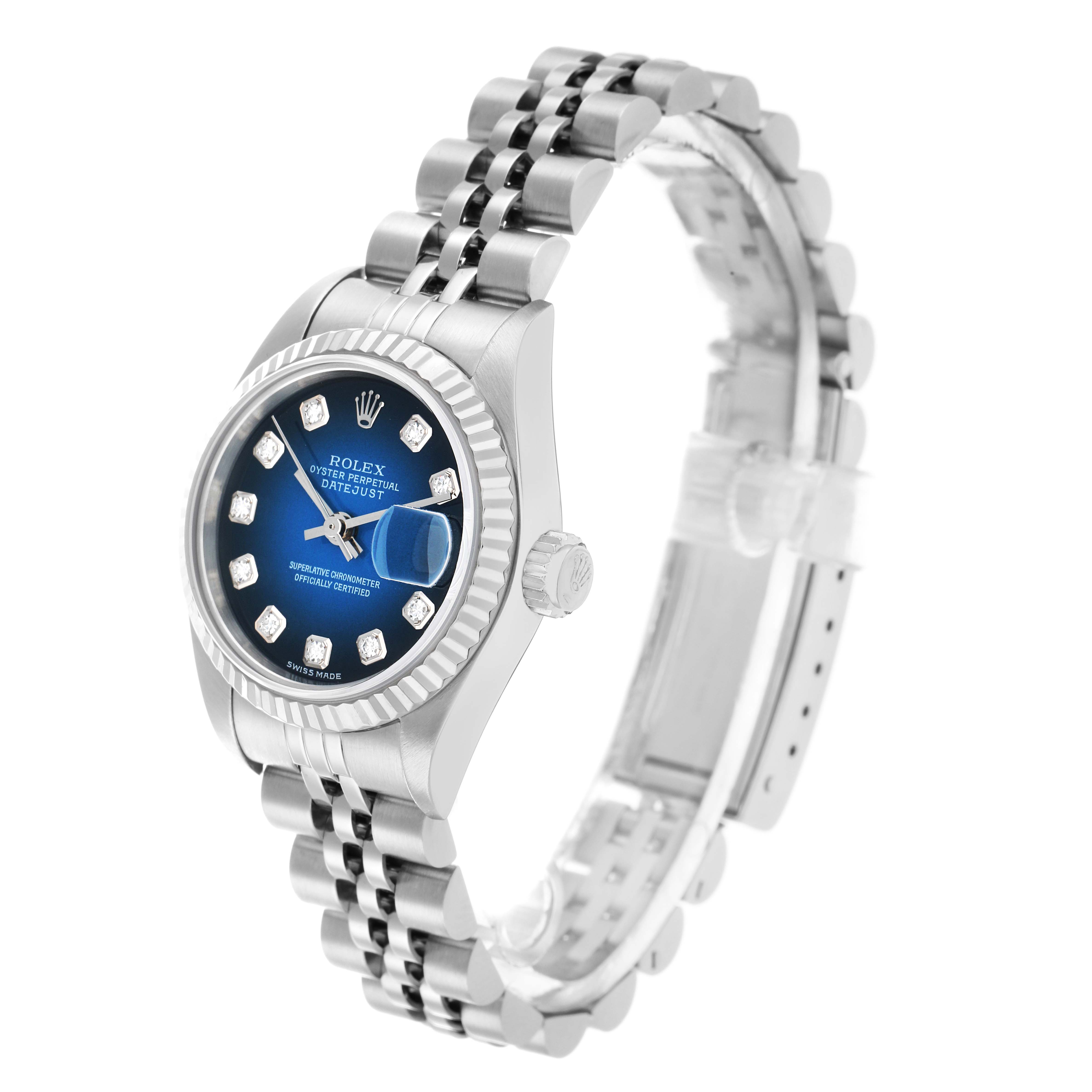 The Rolex Datejust 79174 Women's Stainless Steel Blue Dial watch is shown from a three-quarter angle, displaying the dial, bezel, crown, and stainless steel bracelet.