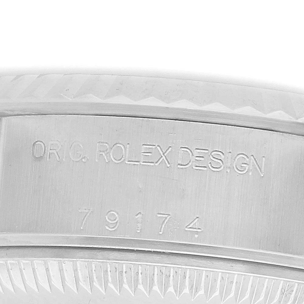 The image shows the engraved side view of a Rolex Datejust 79174 Women's Stainless Steel Blue Dial watch case, highlighting the design and model number.