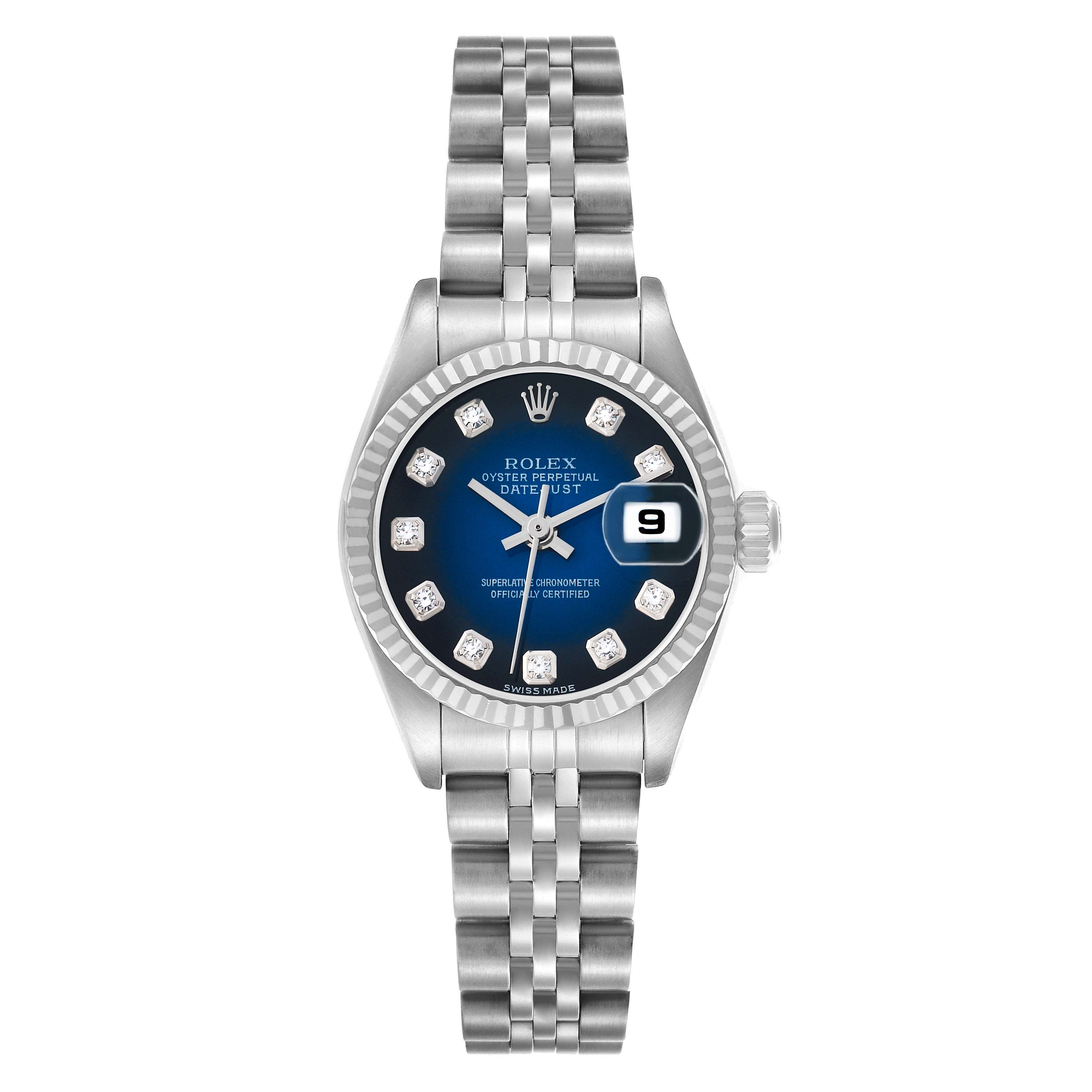 The Rolex Datejust 79174 Women's Stainless Steel Blue Dial watch is shown from a top-down angle, displaying the face, bezel, and bracelet.