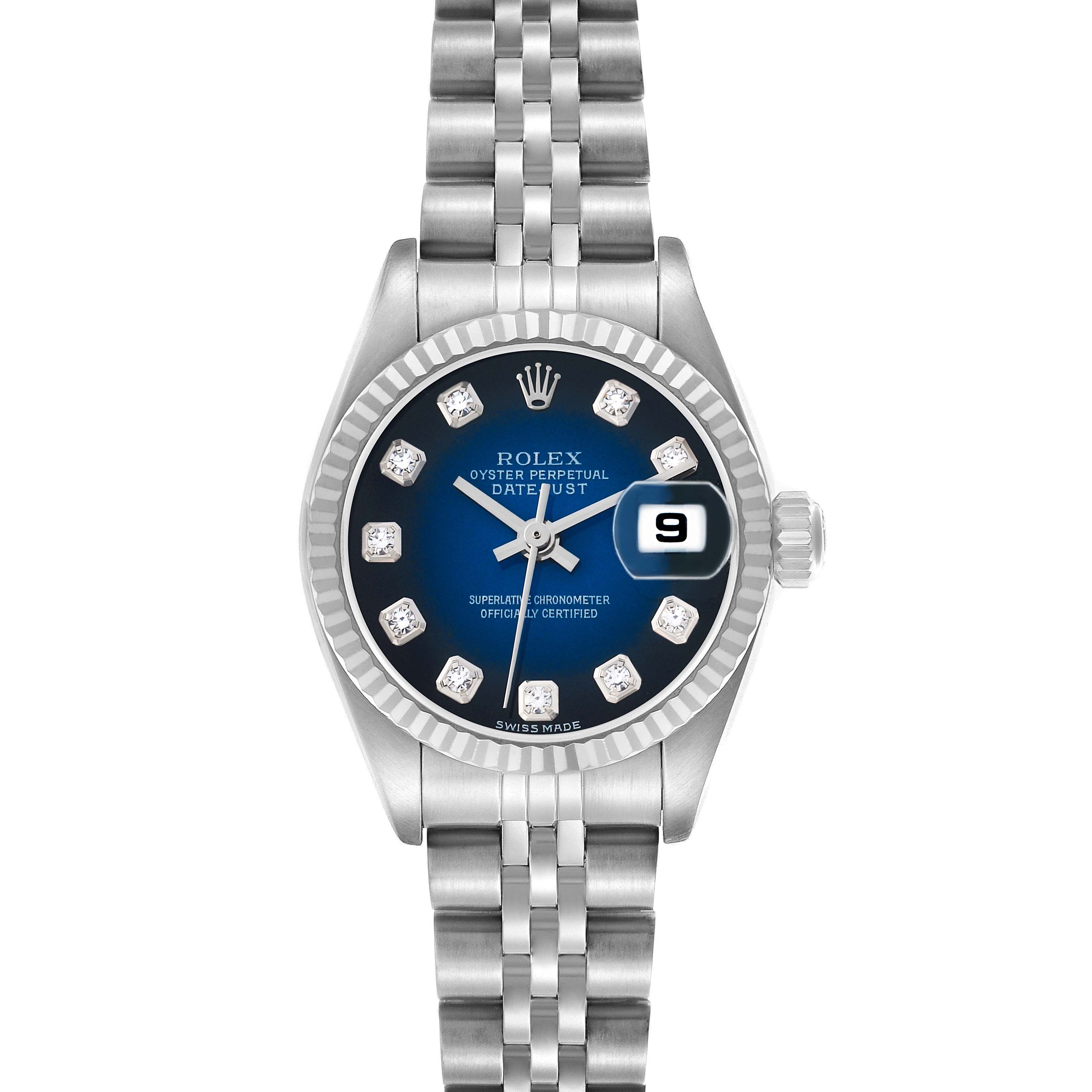The Rolex Datejust 79174 Women's Stainless Steel Blue Dial watch is shown from a top-down angle, displaying the blue dial, bezel, bracelet, and date window.