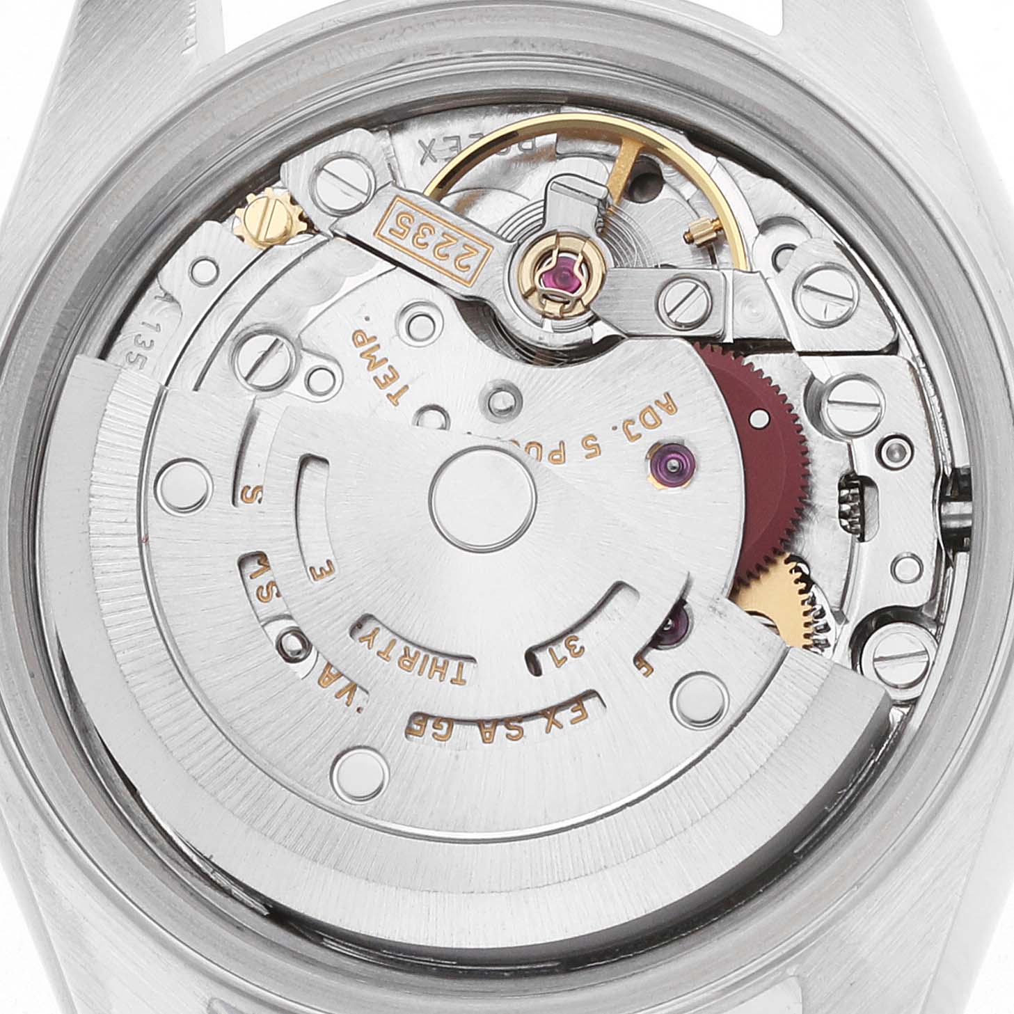 The image shows the movement from a back angle of a Rolex Datejust 79174 Women's Stainless Steel Blue Dial, highlighting the rotor, balance wheel, and gears.