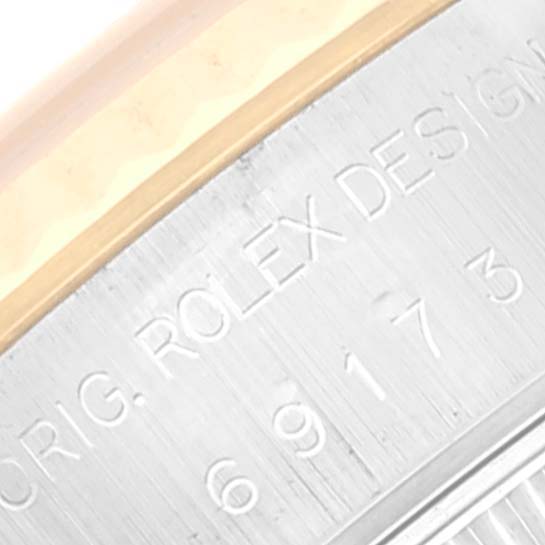 The image shows a close-up view of the serial number engraving on the casing of a Rolex Datejust 69173 Women's Steel and Gold (two tone) Black Dial 69173 Women's Steel and Gold (two tone) Black Dial watch.