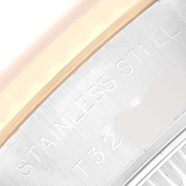 The image shows a close-up of the stainless steel case of a Rolex Datejust 69173 Women's Steel and Gold (two tone) Black Dial 69173 Women's Steel and Gold (two tone) Black Dial watch, highlighting the edge and engraved text.