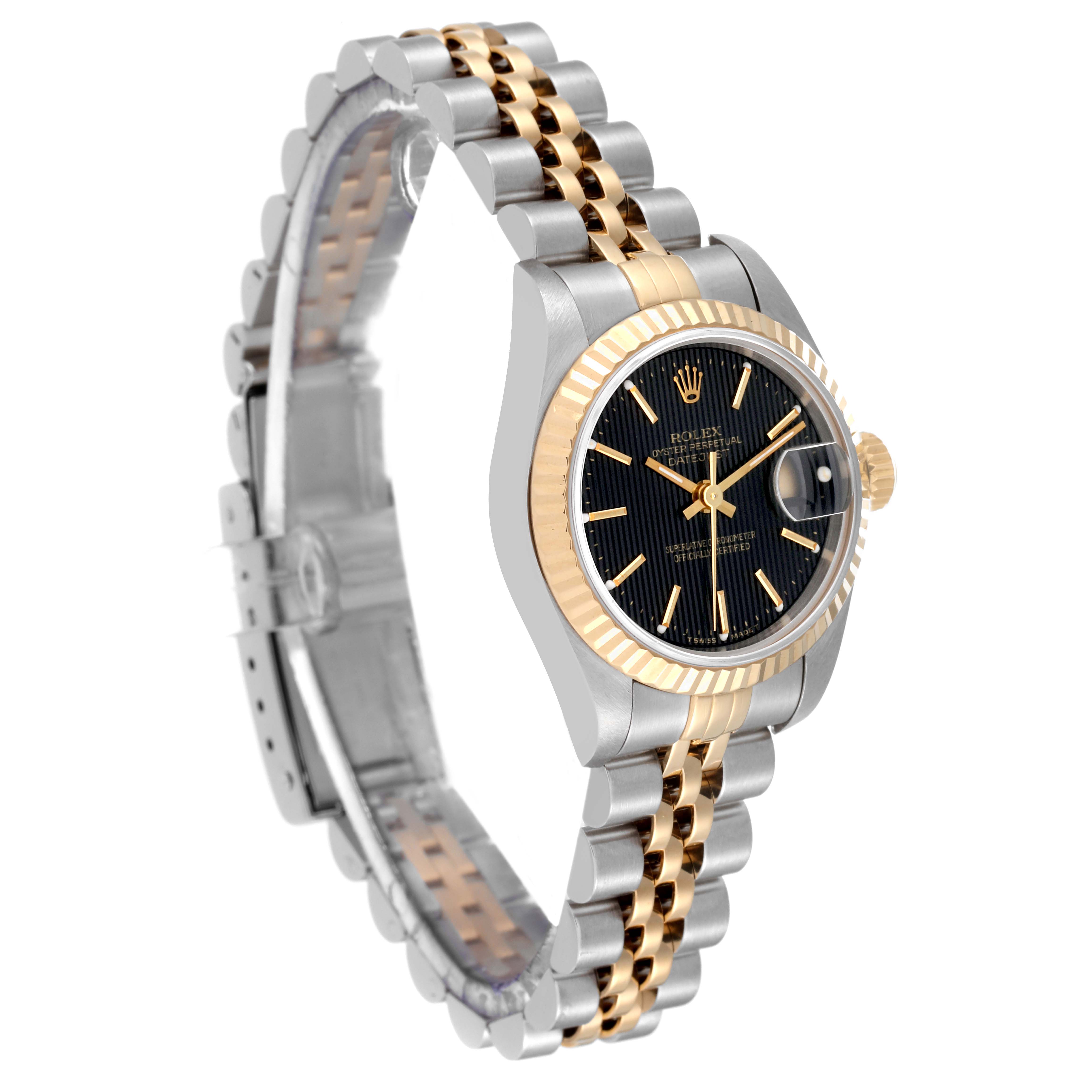 The Rolex Datejust 69173 Women's Steel and Gold (two tone) Black Dial 69173 Women's Steel and Gold (two tone) Black Dial watch is shown at a slight angle highlighting its black dial, two-tone bracelet, and fluted bezel.