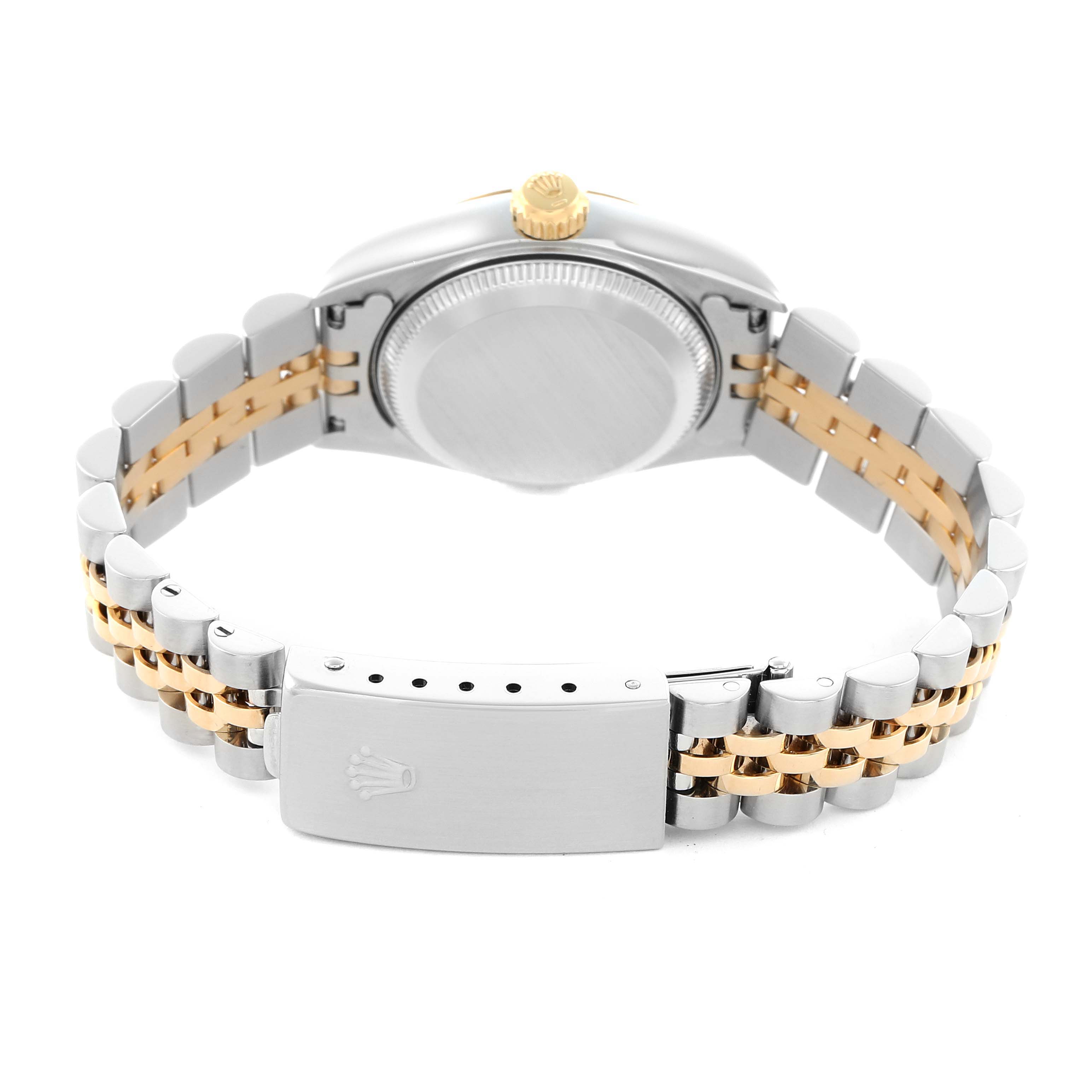The Rolex Datejust 79173 Women's Steel and Gold (two tone) Champagne Dial watch is shown from the back, highlighting the clasp and two-tone bracelet.