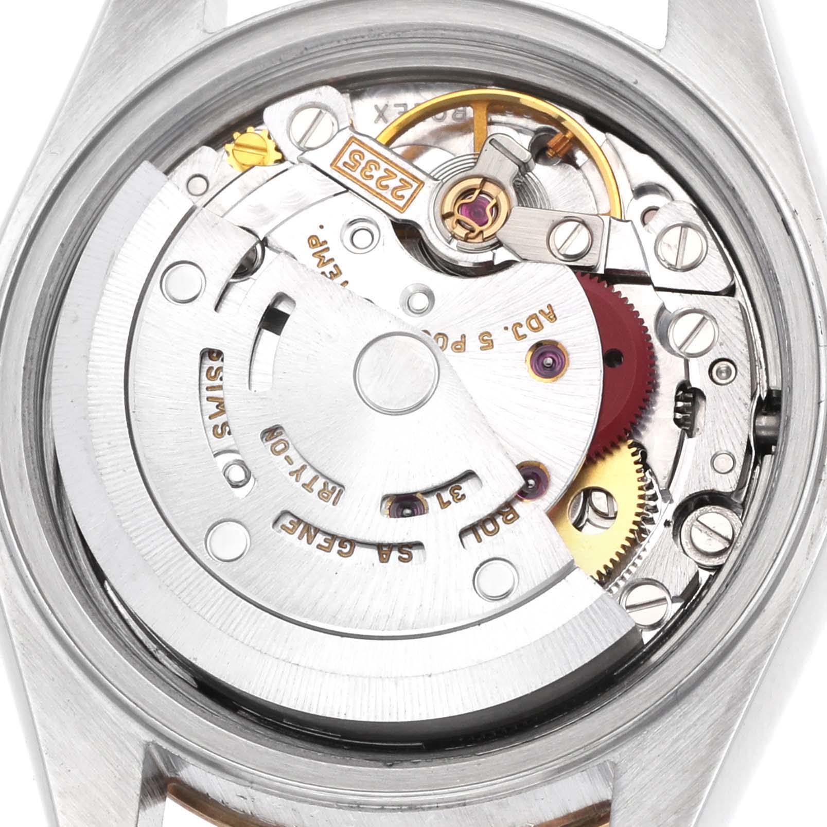 The image shows the movement of a Rolex Datejust 79173 Women's Steel and Gold (two tone) Champagne Dial watch from a top-down angle, highlighting gears and components inside.