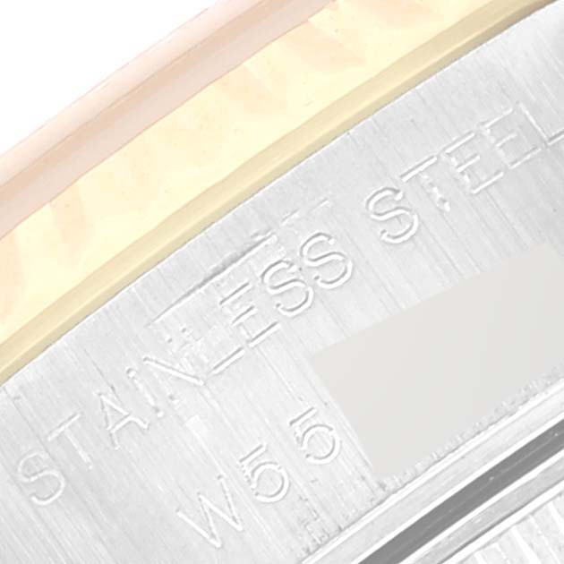 The image shows a macro shot of the engraving on the side of a Rolex Datejust 69173 Women's Steel and Gold (two tone) Champagne Dial 69173 Women's Steel and Gold (two tone) Champagne Dial watch case, highlighting the "Stainless Steel" text.