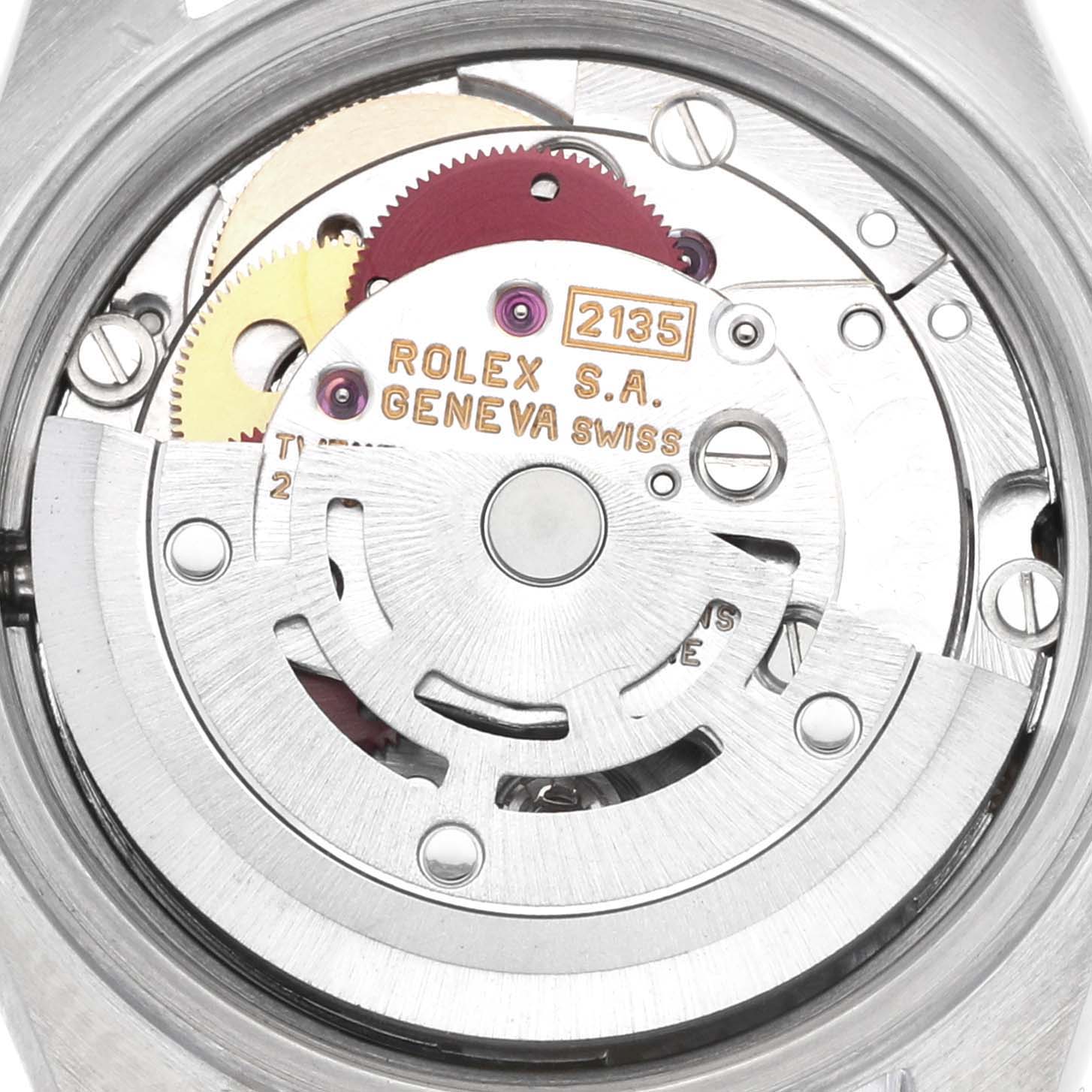 The image shows the movement of a Rolex Datejust 69173 Women's Steel and Gold (two tone) Champagne Dial watch, highlighting gears and the rotor from a top-down angle.