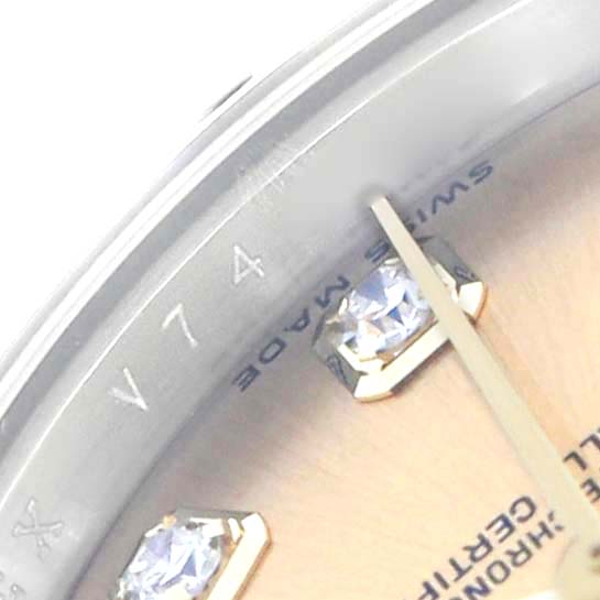 The image shows a close-up of a Rolex Datejust 179313 Women's Steel and Gold (two tone) Champagne Dial watch dial with diamond hour markers and partial view of the minute hand.