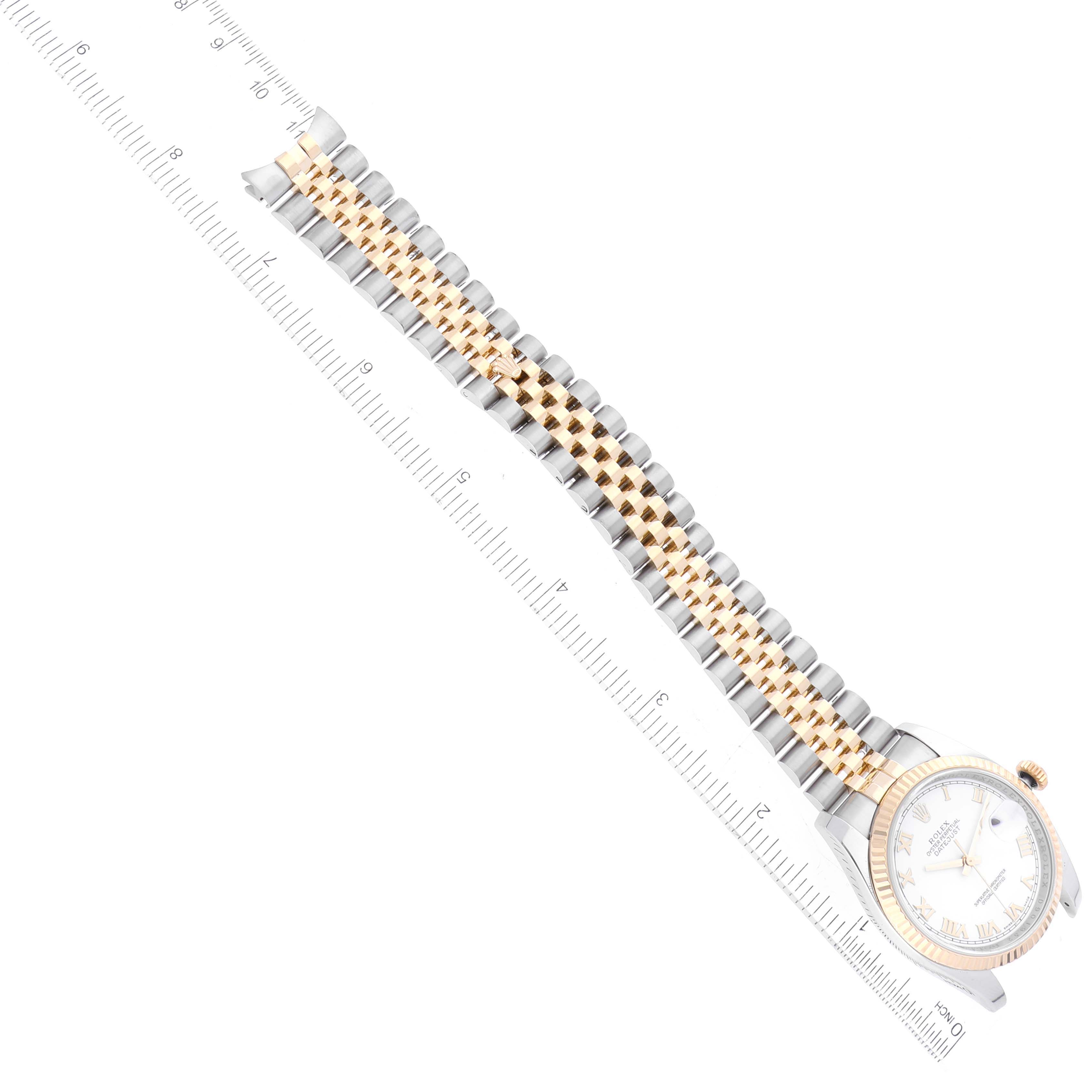 The image shows a Rolex Datejust 116233 Men's Steel and Gold (two tone) White Dial 116233 Men's Steel and Gold (two tone) White Dial watch with a two-tone bracelet laying flat beside a ruler measuring its length.