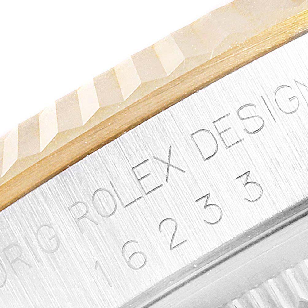 The image shows a close-up of the engraved bezel and part of the text on the Rolex Datejust 16233 Men
s Steel and Gold (two tone) White Dial 16233 Men
s Steel and Gold (two tone) White Dial watch.
