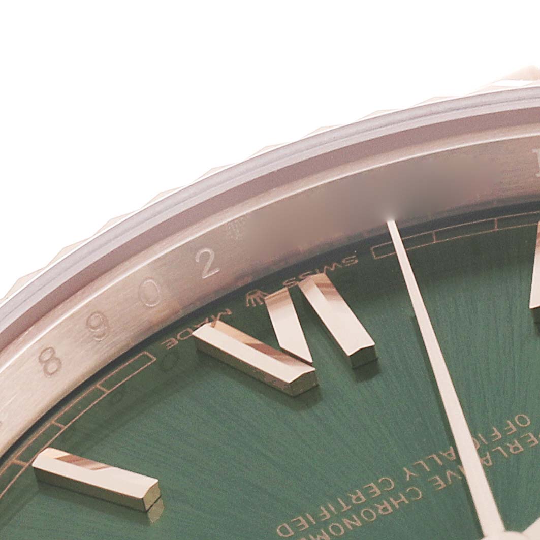 This image shows a close-up of the dial and bezel edge of a Rolex President 228235 Men's Rose Gold Green Dial 228235 Men's Rose Gold Green Dial model watch.