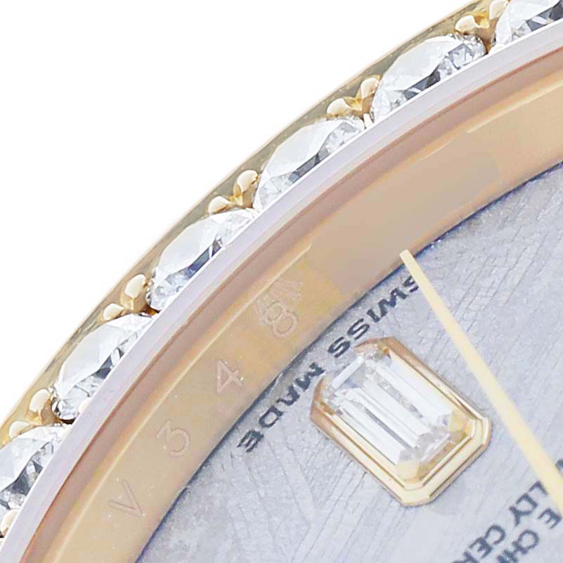 The image shows a close-up of a Rolex Pearlmaster 18948 Men
s Yellow Gold Silver Dial watch, highlighting the diamond bezel and part of the dial with a gem-set marker.