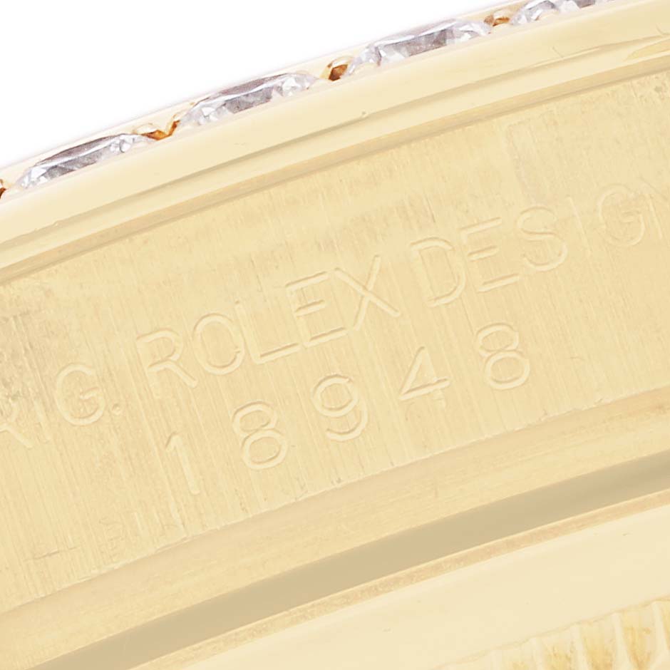 The image shows a close-up of the engraved side of a Rolex Pearlmaster 18948 Men
s Yellow Gold Silver Dial watch, displaying part of the model number.