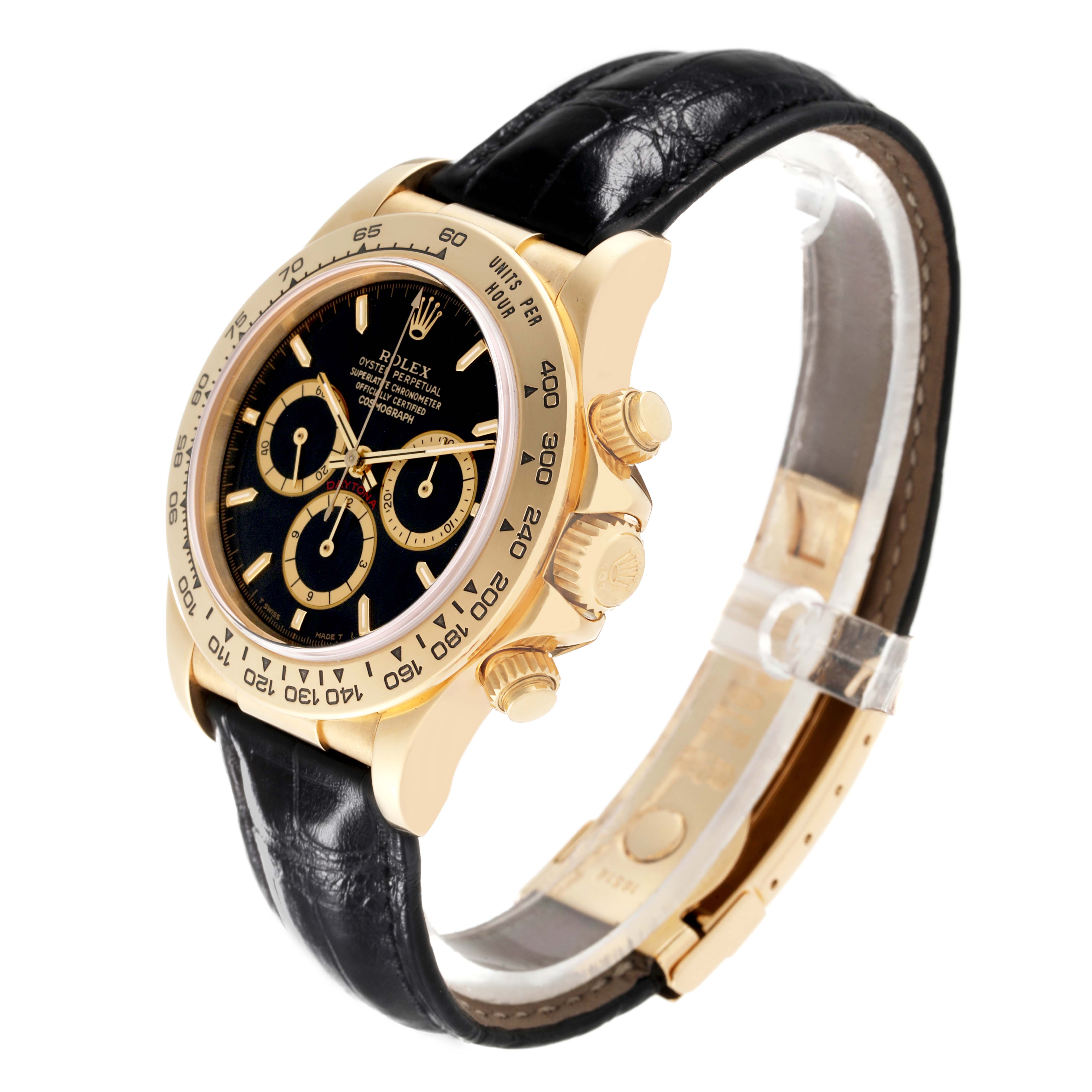 The Rolex Daytona 16518 Men's Yellow Gold Black Dial 16518 Men's Yellow Gold Black Dial watch is shown at a tilted angle, displaying its black dial, gold case, chronograph subdials, and black leather strap.