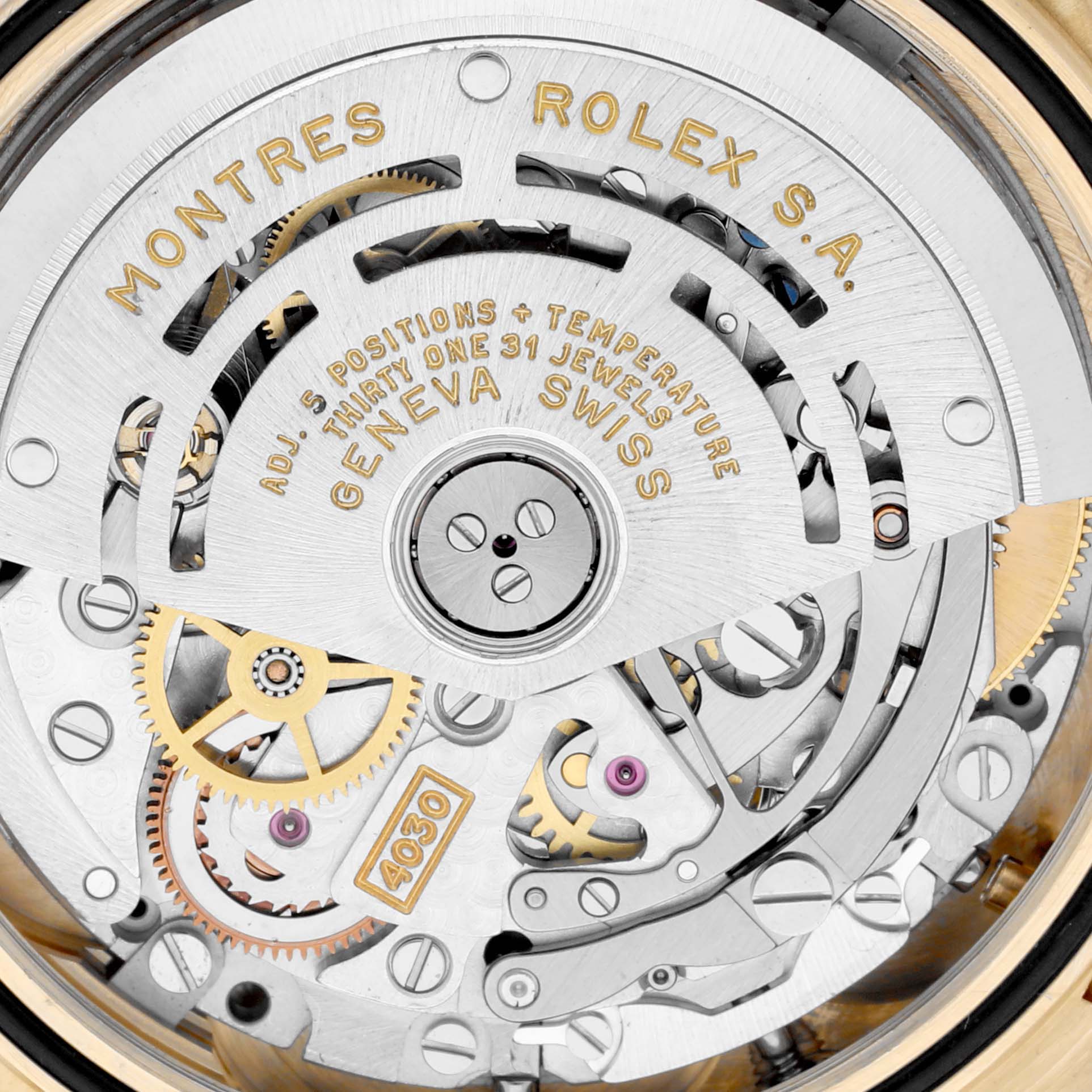 This is a close-up image of the Rolex Daytona 16518 Men's Yellow Gold Black Dial 16518 Men's Yellow Gold Black Dial's movement, highlighting the intricate gears and engravings.