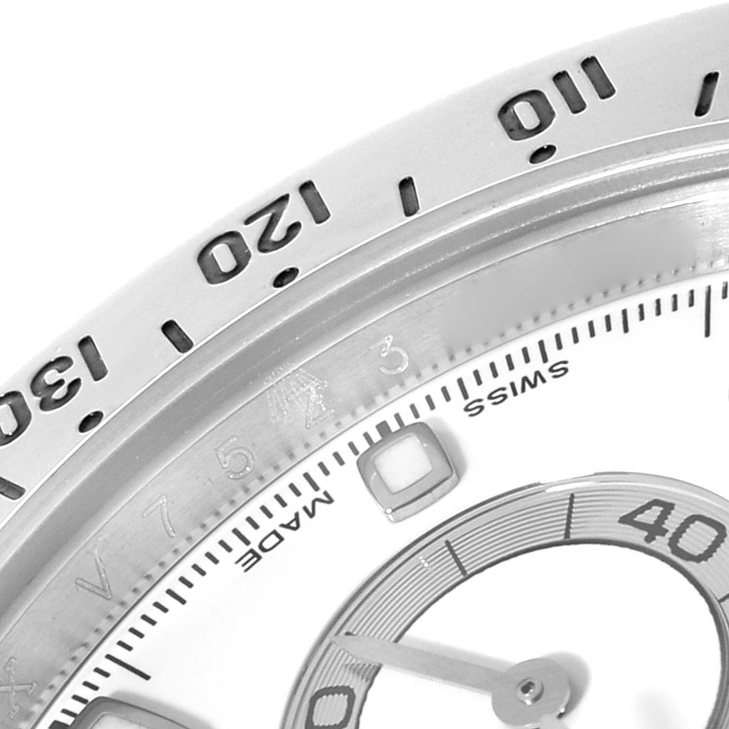 This image shows a close-up of the dial and bezel of a Rolex Daytona 116520 Men's Stainless Steel White Dial 116520 Men's Stainless Steel White Dial, emphasizing numbers and part of the sub-dial.