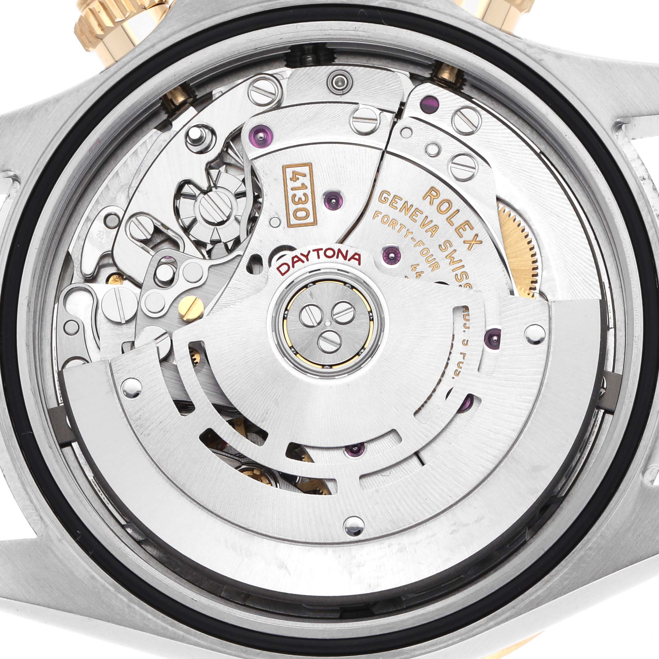 The image shows the movement of a Rolex Daytona 116503 Men
s Steel and Gold (two tone) Black Dial watch from a rear angle, highlighting its intricate mechanical parts.