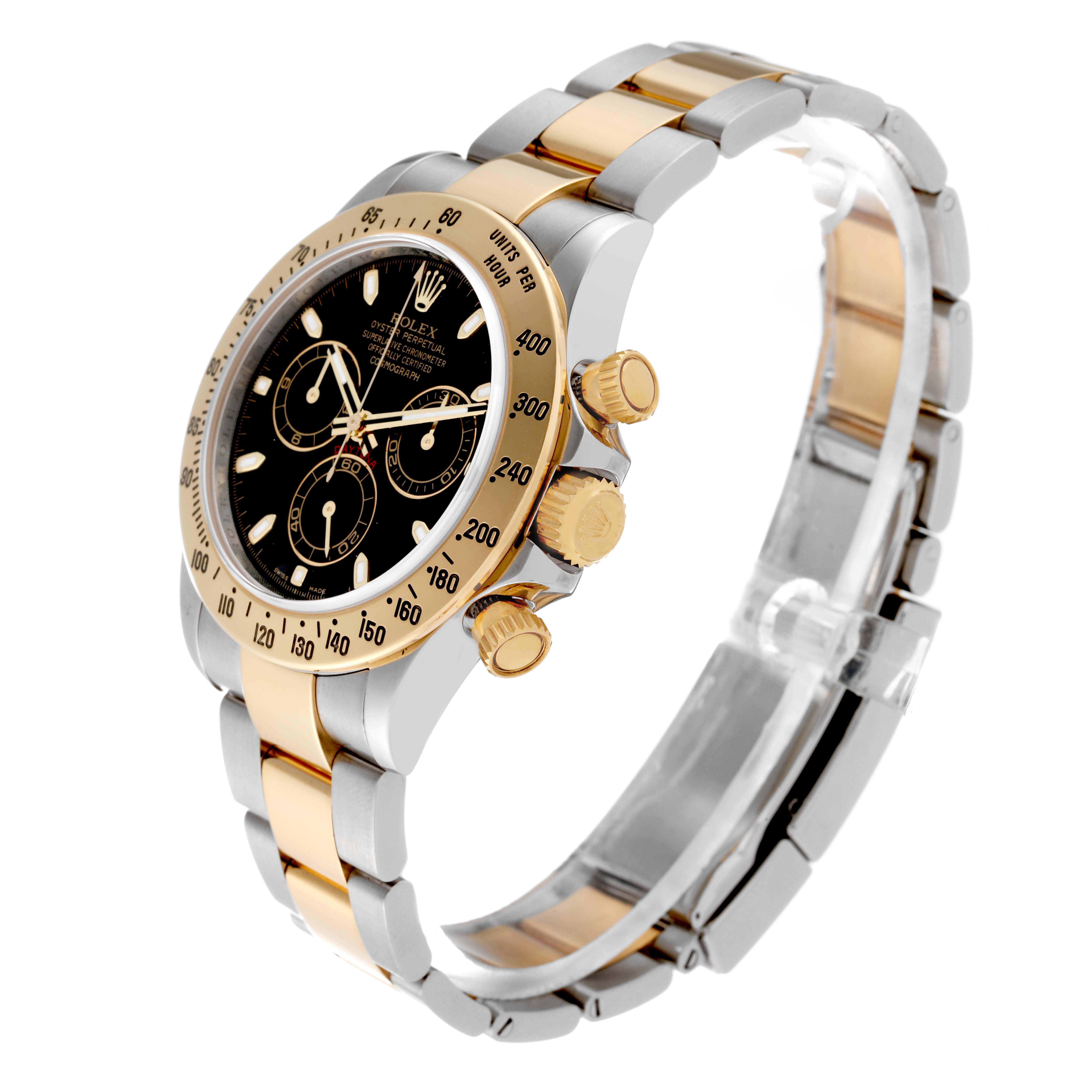 The Rolex Daytona 116523 Men's Steel and Gold (two tone) Black Dial 116523 Men's Steel and Gold (two tone) Black Dial watch is shown from an angled side view, highlighting its bezel, dial, crown, and two-tone bracelet.