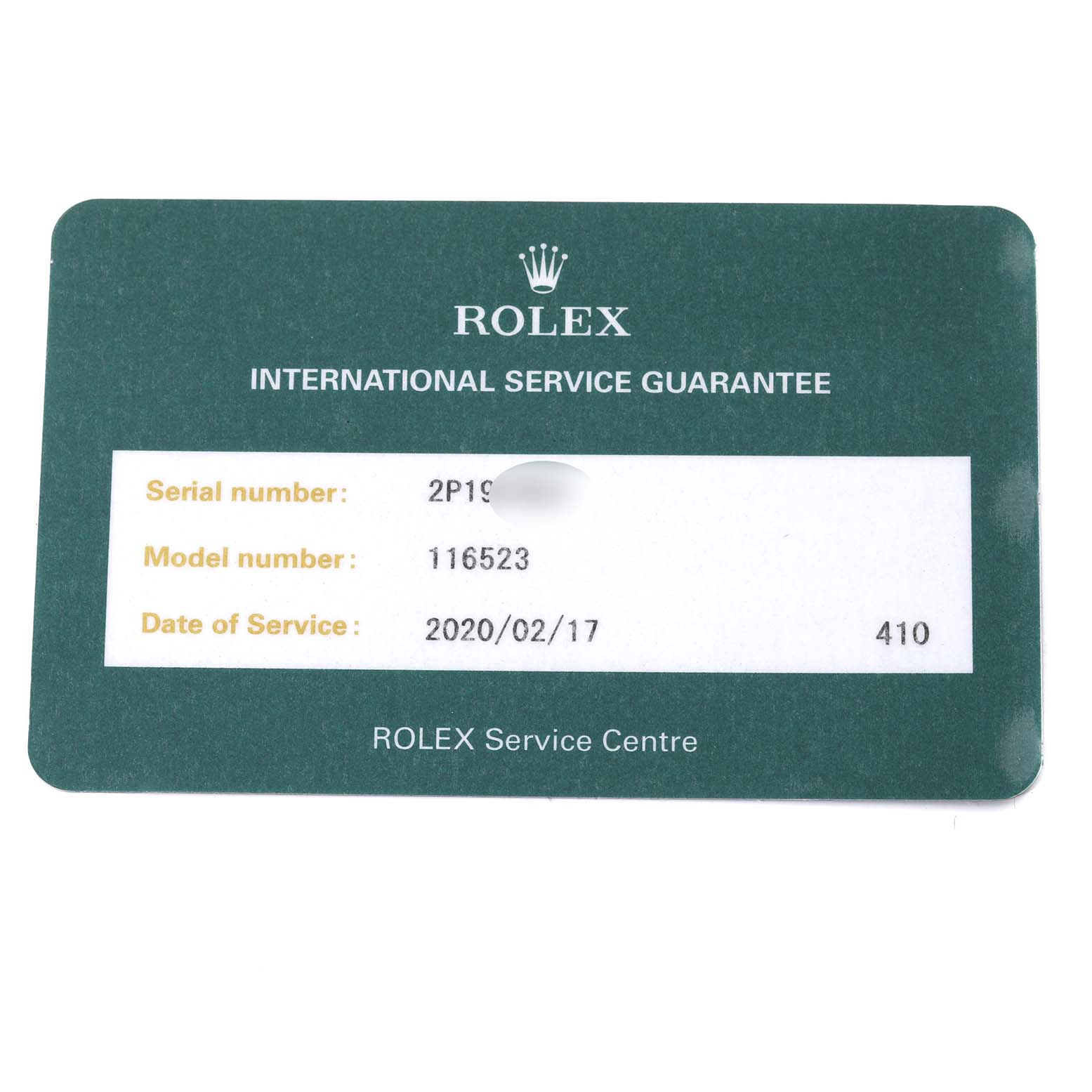 This image shows an International Service Guarantee card for the Rolex Daytona 116523 Men's Steel and Gold (two tone) Black Dial 116523 Men's Steel and Gold (two tone) Black Dial model 116523.