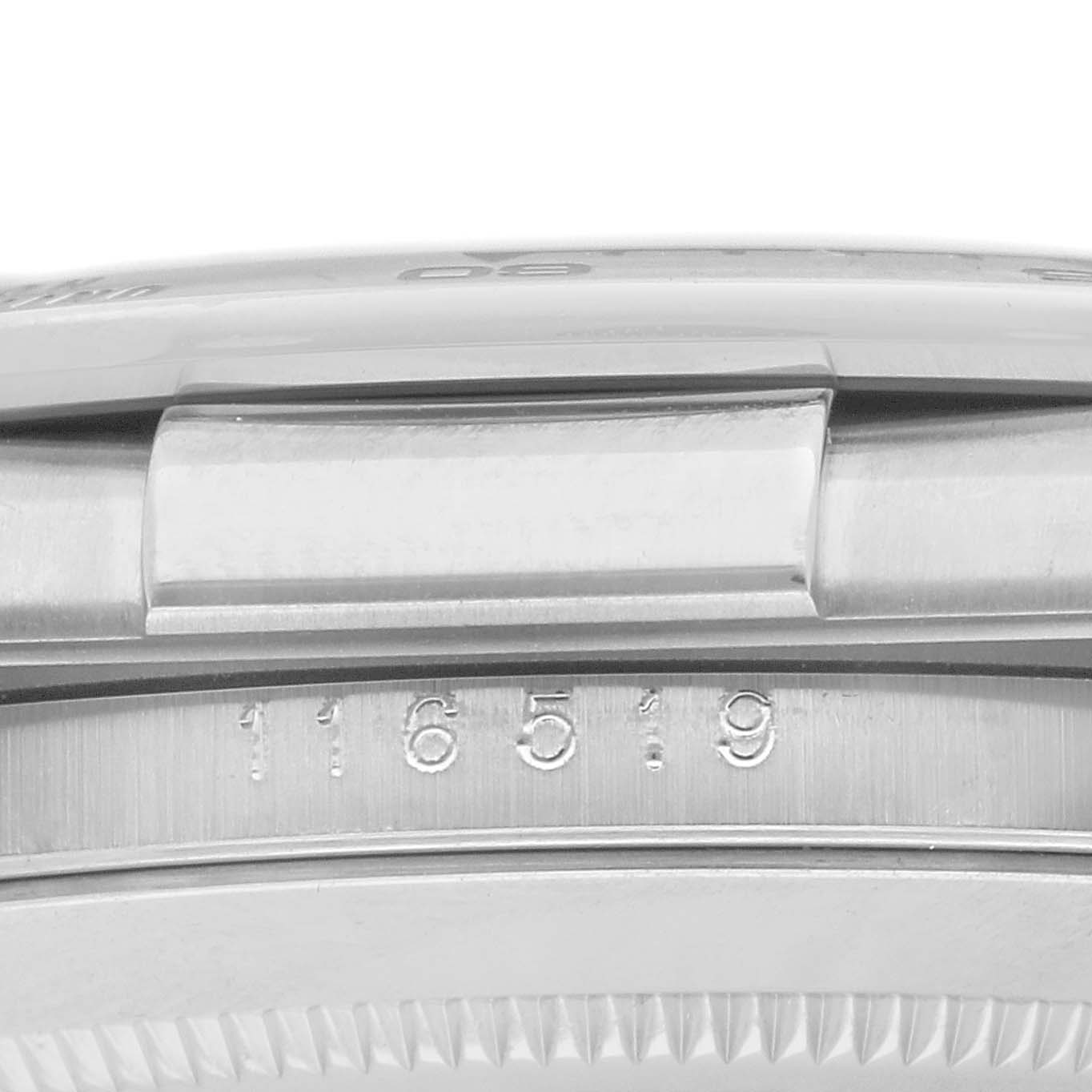The image shows a close-up side view of the case and engraved model number of a Rolex Daytona 116519 Men
s White Gold Silver Dial watch.