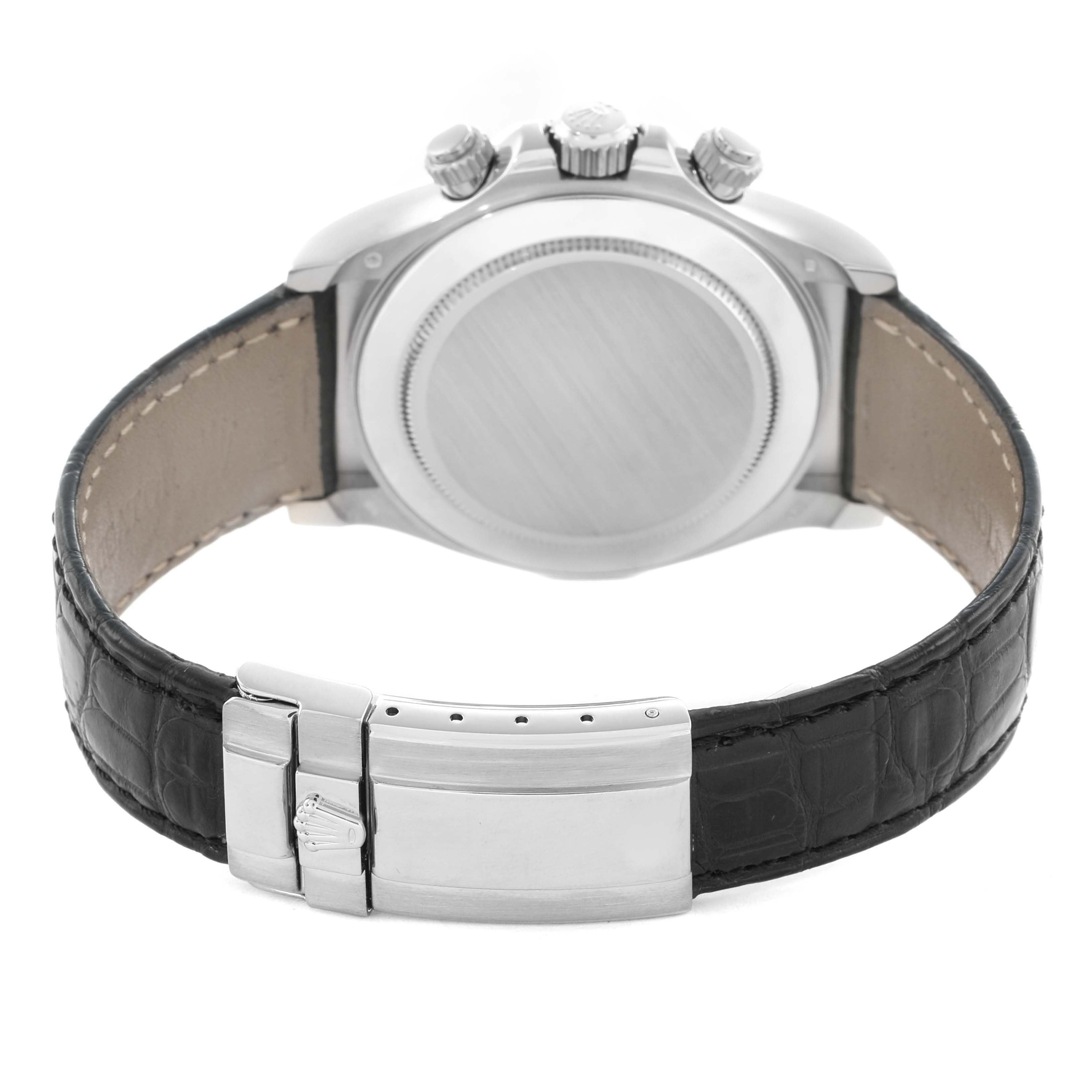 The Rolex Daytona 116519 Men
s White Gold Silver Dial watch is shown from the back, highlighting the case, crown, pushers, and leather strap with clasp.
