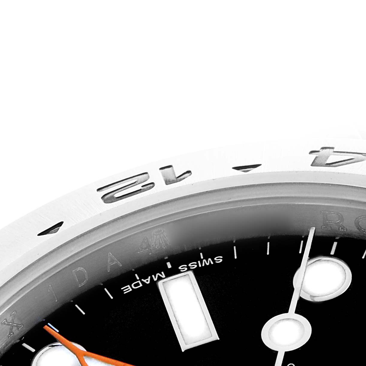 The image shows a close-up of the dial and part of the bezel of the Rolex Explorer 216570 Men
s Stainless Steel Black Dial, highlighting the markers and hands.
