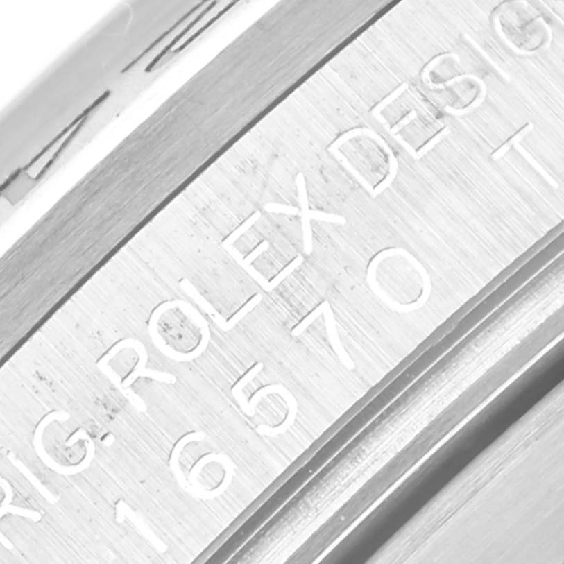 This close-up image shows part of the caseback engraving on a Rolex Explorer 16570 Men's Stainless Steel White Dial 16570 Men's Stainless Steel White Dial watch.