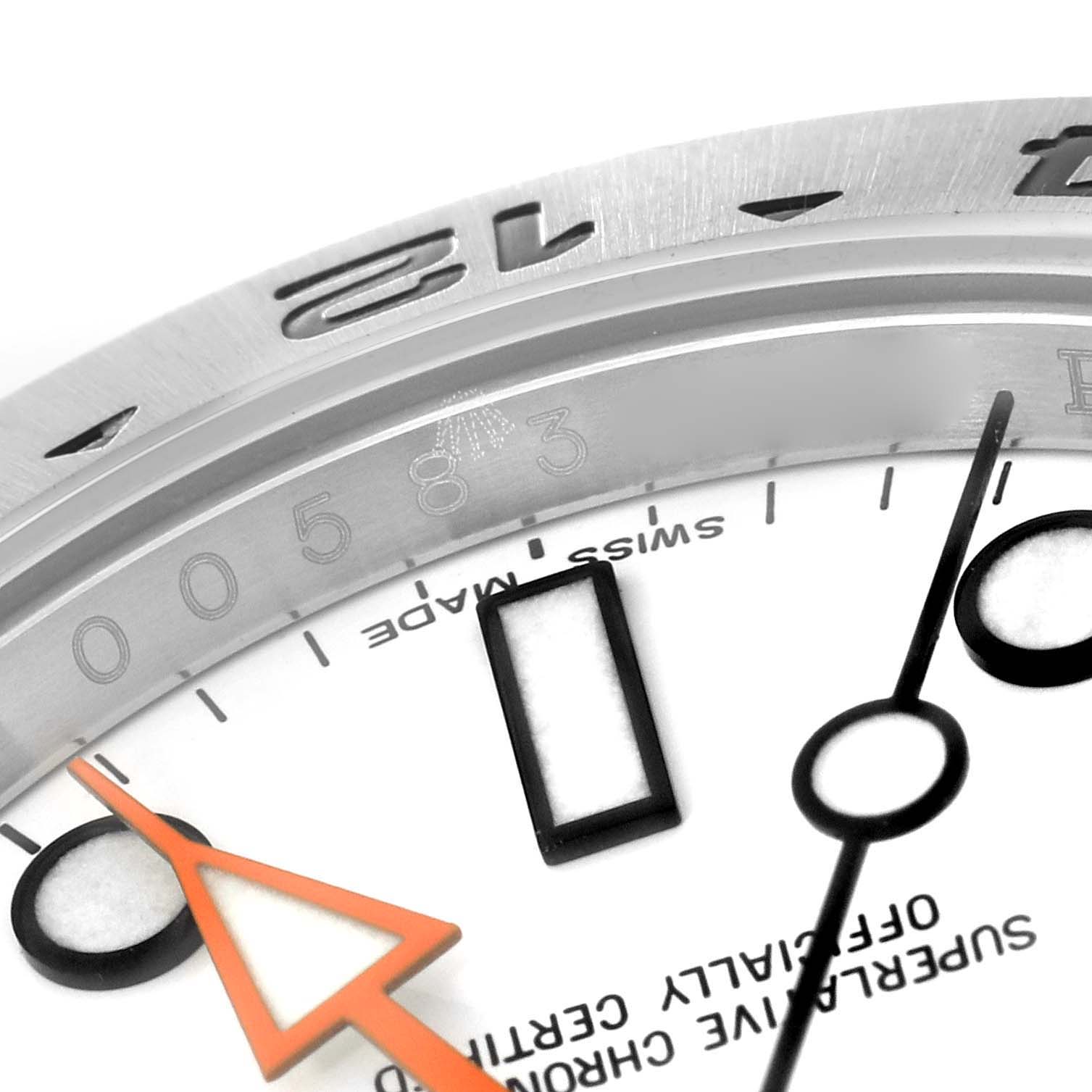 This image shows a close-up angle of the dial, markers, and part of the bezel of the Rolex Explorer 216570 Men's Stainless Steel White Dial 216570 Men's Stainless Steel White Dial watch.