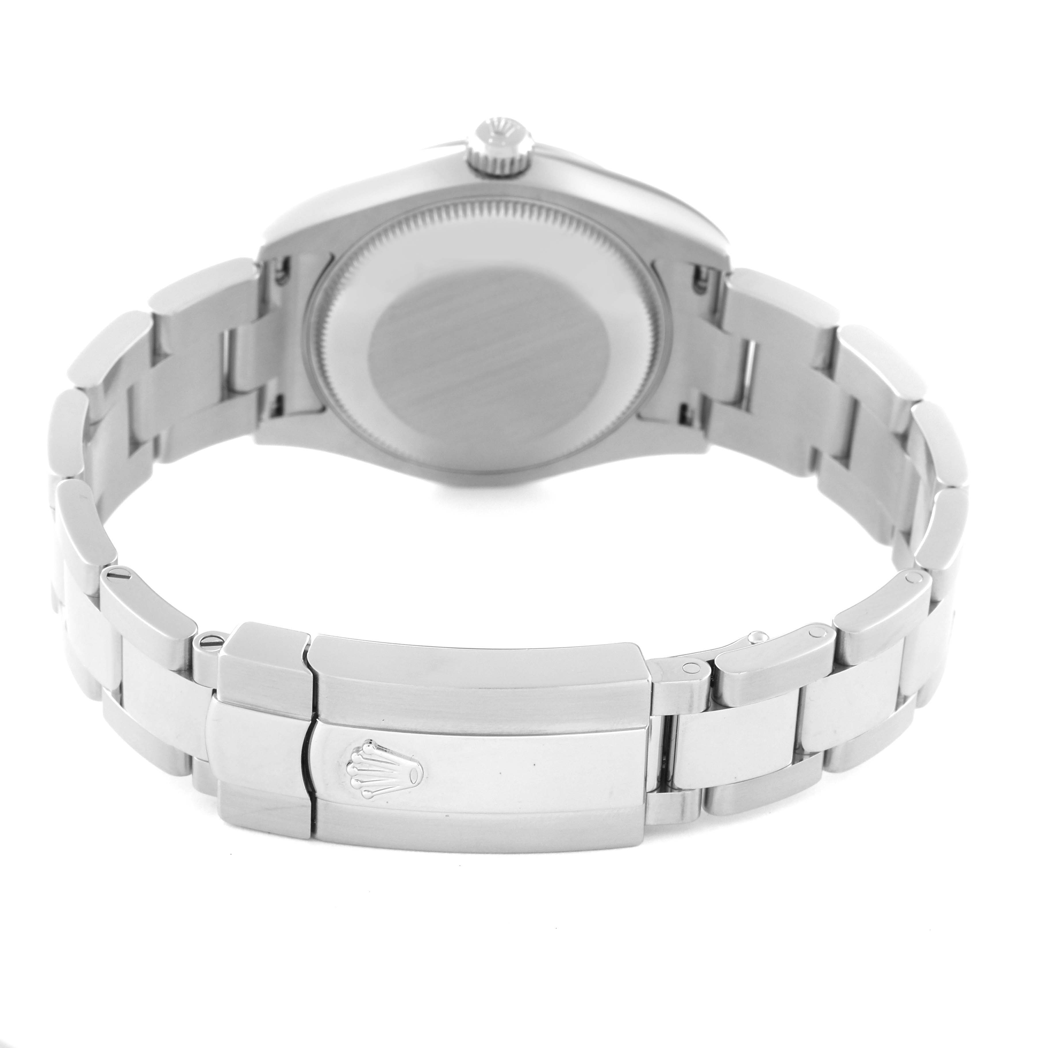 The image shows the back and bracelet clasp of a Mid-Size Rolex watch, focusing on the caseback and closure mechanism.