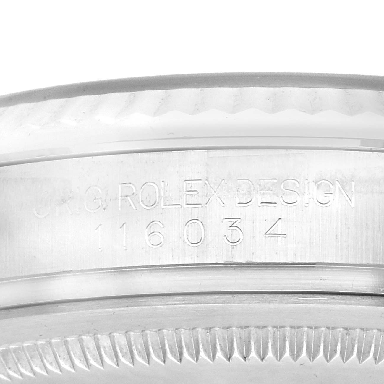 The image shows a close-up of the case side of a Rolex Oyster Perpetual 116034 Men's Stainless Steel Blue Dial, highlighting the model engraving.