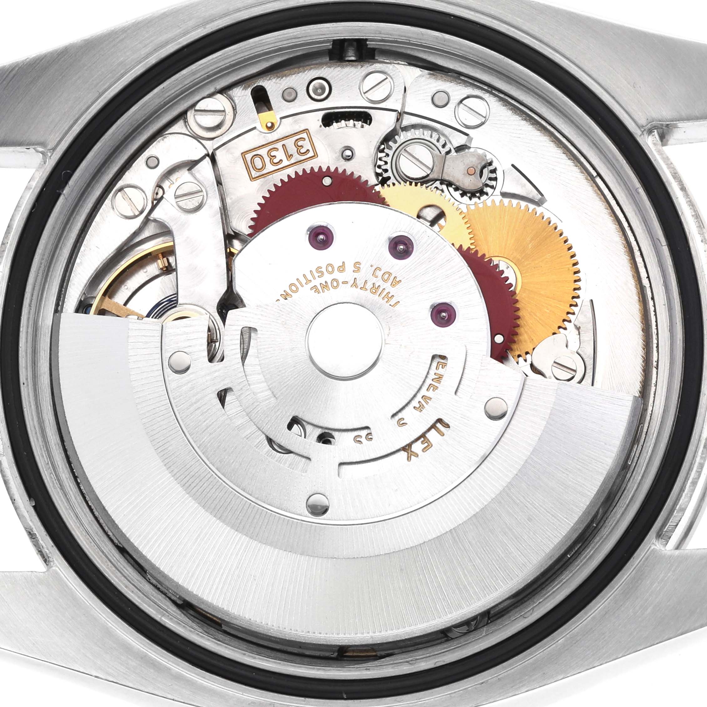 The image shows the movement of a Rolex Oyster Perpetual 116034 Men's Stainless Steel Blue Dial watch from a top-down angle, highlighting its gears and rotor.