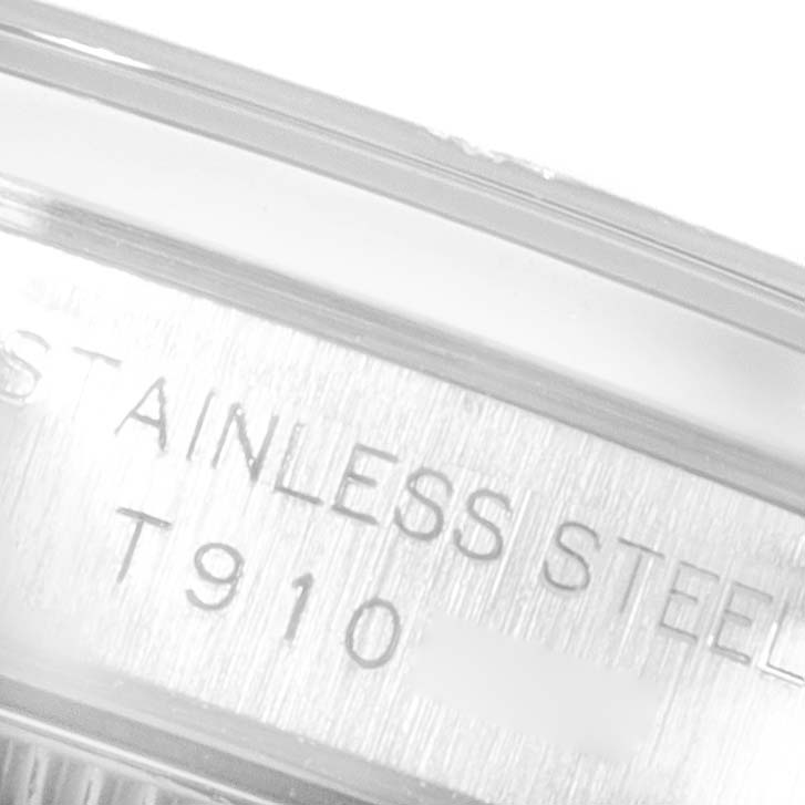 This close-up image shows the "STAINLESS STEEL" inscription and model number engraving on the Oyster Perpetual by Rolex.