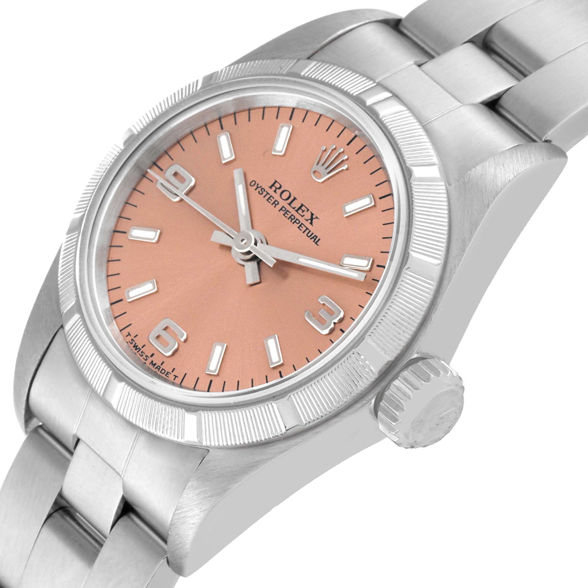 This image shows a close-up, angled view of the Rolex Oyster Perpetual 67230 Women's Stainless Steel Pink Dial 67230 Women's Stainless Steel Pink Dial watch, highlighting the face, crown, and part of the bracelet.