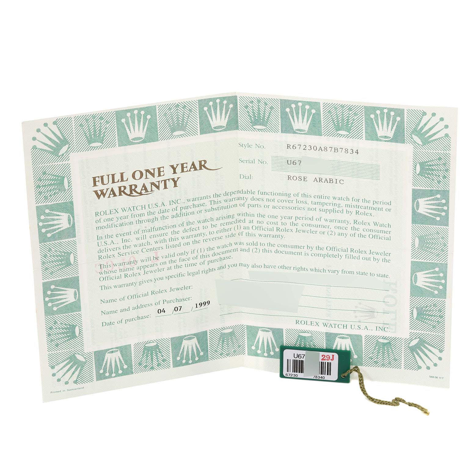 The image shows a full one-year warranty card for a Rolex Oyster Perpetual 67230 Women's Stainless Steel Pink Dial 67230 Women's Stainless Steel Pink Dial model along with a green tag accessory.