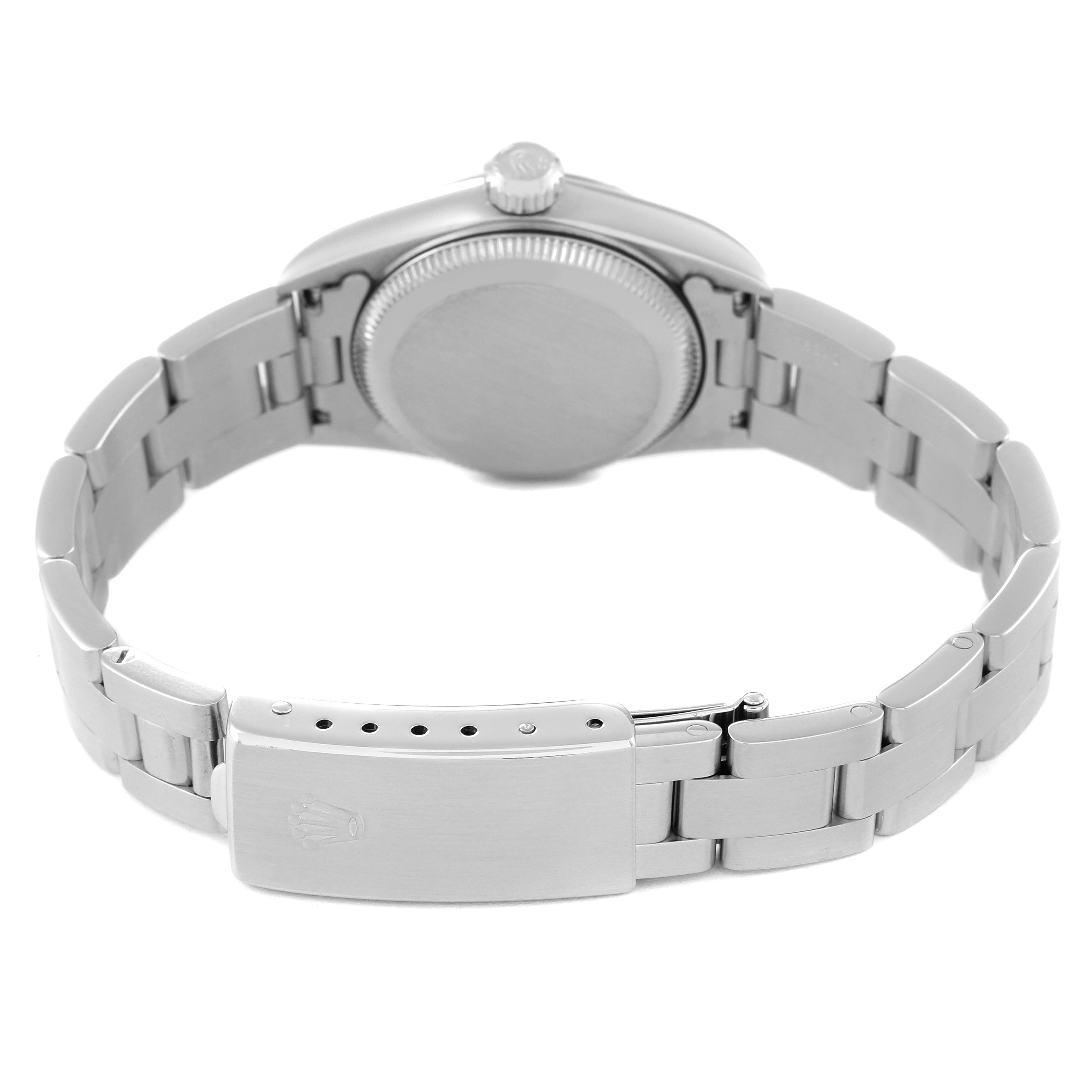 This image shows the back view of a Rolex Oyster Perpetual 67230 Women's Stainless Steel Pink Dial 67230 Women's Stainless Steel Pink Dial watch, highlighting its bracelet and clasp.