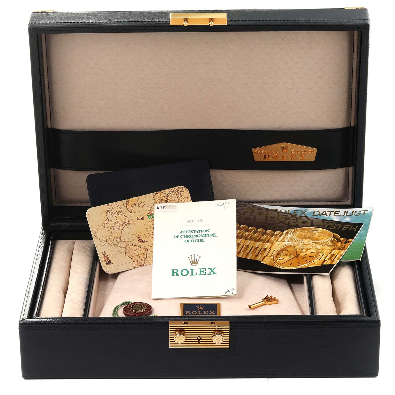 The image shows the open box of a Rolex Pearlmaster 69298 Women's Yellow Gold Champagne Dial 69298 Women's Yellow Gold Champagne Dial watch with manuals, warranty papers, and other accessories.