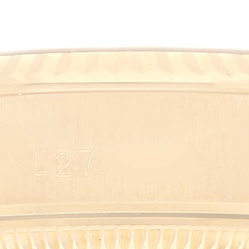 The image shows a close-up view of the side of the case of a Rolex President 69178 Women's Yellow Gold Black Dial 69178 Women's Yellow Gold Black Dial model watch.