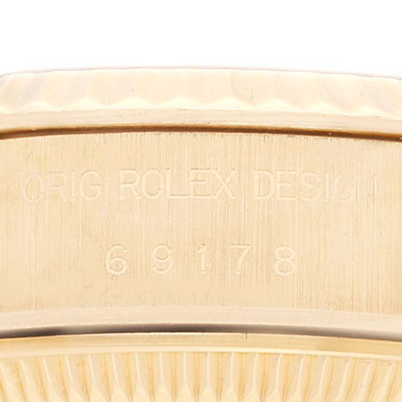 The image shows a close-up detail of the side of a Rolex President 69178 Women
s Yellow Gold Champagne Dial 69178 Women
s Yellow Gold Champagne Dial model, focusing on the etched model number "69178."