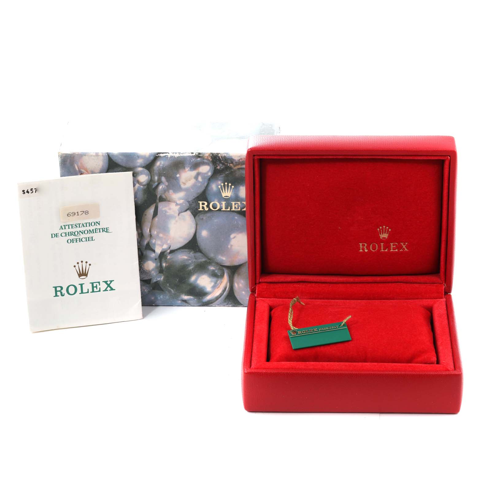 The image shows the packaging, including a red Rolex box and paperwork,  for a Rolex President 69178 Women
s Yellow Gold Champagne Dial 69178 Women
s Yellow Gold Champagne Dial model watch.