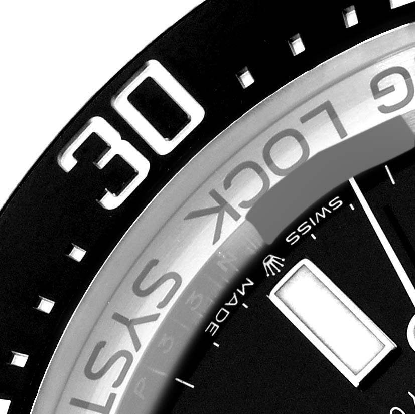 The image shows a close-up of the bezel and partially the dial of the Rolex Sea-Dweller 126660 Men
s Stainless Steel Black Dial 126660 Men
s Stainless Steel Black Dial watch, featuring the "30" marker.