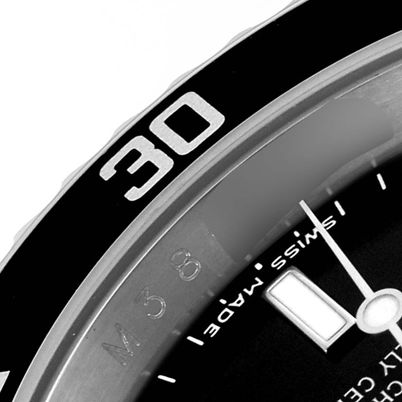 The image shows a close-up of the bezel and part of the dial of the Rolex Submariner 16610 Men
s Stainless Steel Black Dial 16610 Men
s Stainless Steel Black Dial watch.