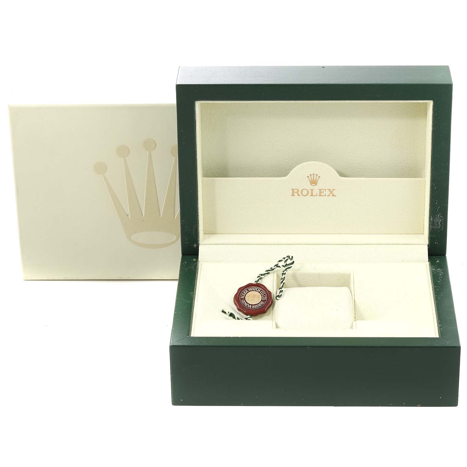 This image shows an open Rolex Submariner 16610 Men
s Stainless Steel Black Dial 16610 Men
s Stainless Steel Black Dial watch box with its tag and cushion, viewed from the front.